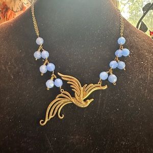 Antique bird in flight, periwinkle crystals